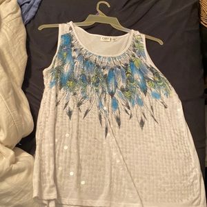 Peacock white shirt with sequins on it.